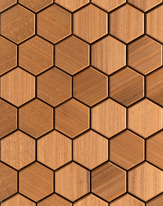 Close-up of pale honey-toned Abachi hexagon wood paneling